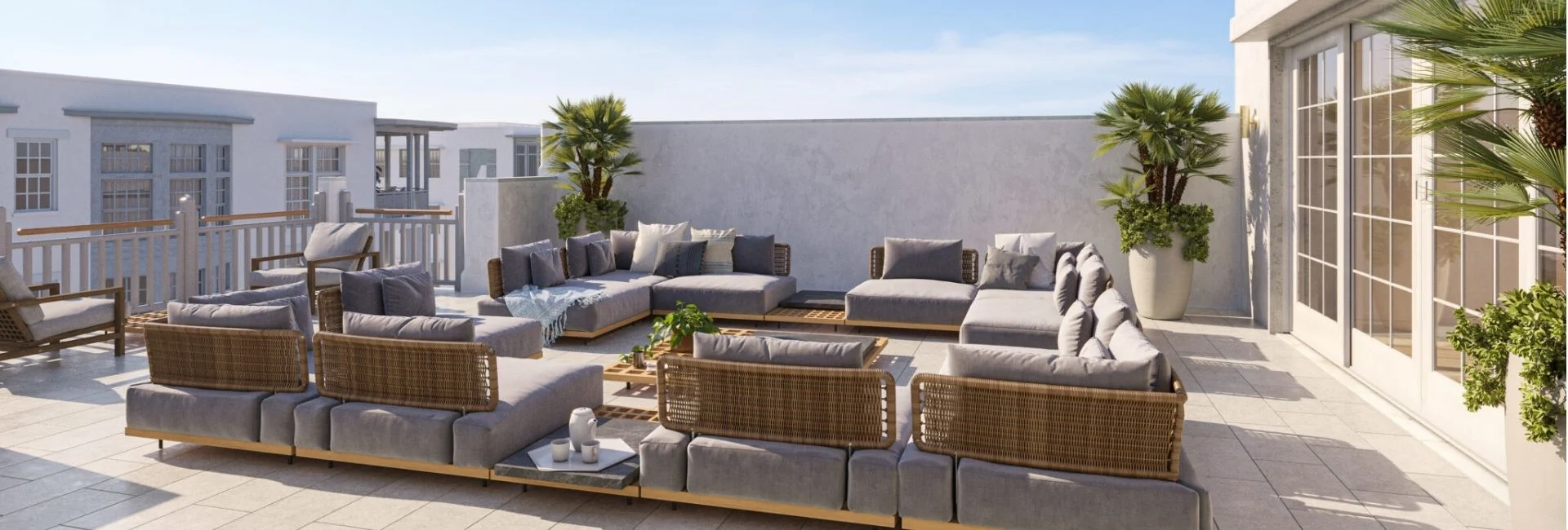 Spacious outdoor seating area on rooftop terrace with modern wicker sofas and potted palms, part of Lake Norman townhomes. Spacious outdoor seating area on rooftop terrace with modern wicker sofas and potted palms, part of Lake Norman townhomes.