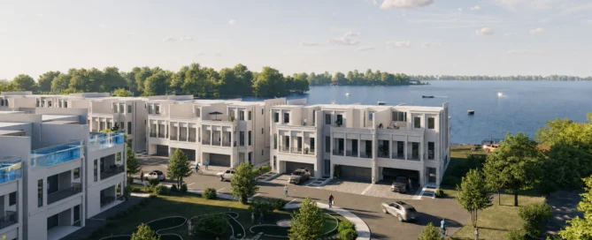 Modern Lake Norman townhomes with balconies, near a scenic waterfront. Cars and people in landscaped surroundings, boats on the lake.